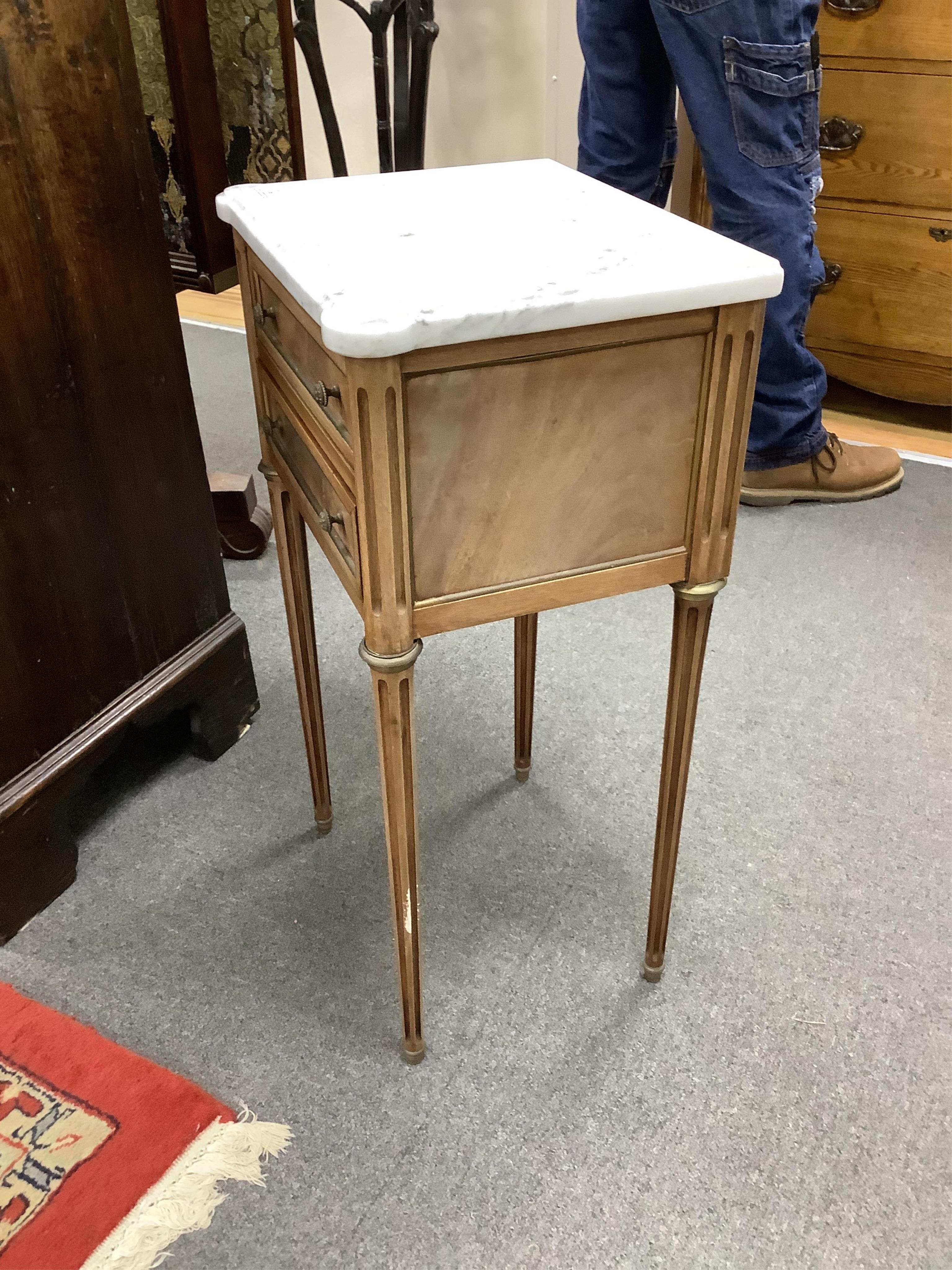A pair of French brass mounted mahogany marble topped two drawer bedside chests, width 38cm, depth 30cm, height 68cm